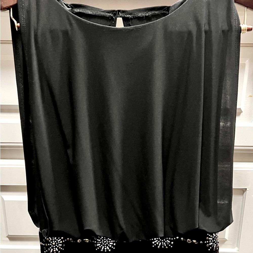Black dress by Betsy and Adam Looks amazing on. very flattering. Size 12